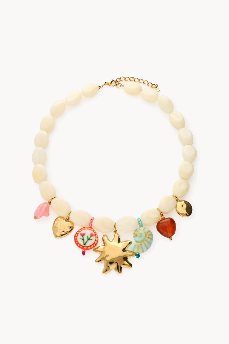 Beige beaded necklace with multicoloured charms