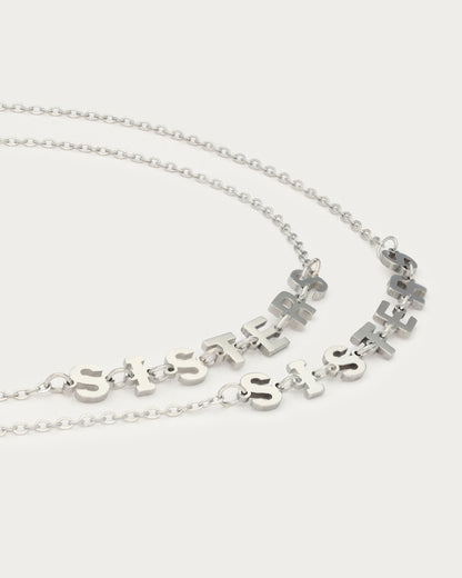 Bracelets Sisters — détail des lettres SISTERS, argenté