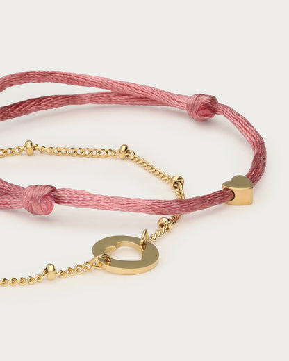 Bracelets duo mère-fille mini, cordon rose — détail du rond ajouré et du petit cœur
