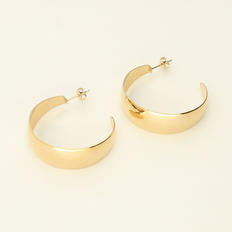 Large hoop earrings in a 90s style