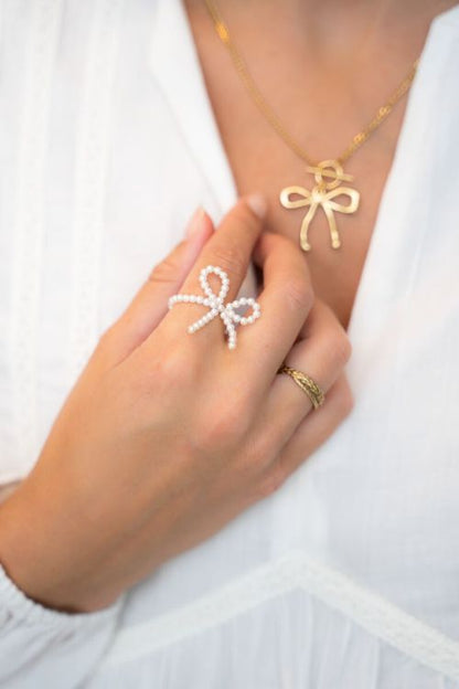 Bague élastique avec perles et noeud