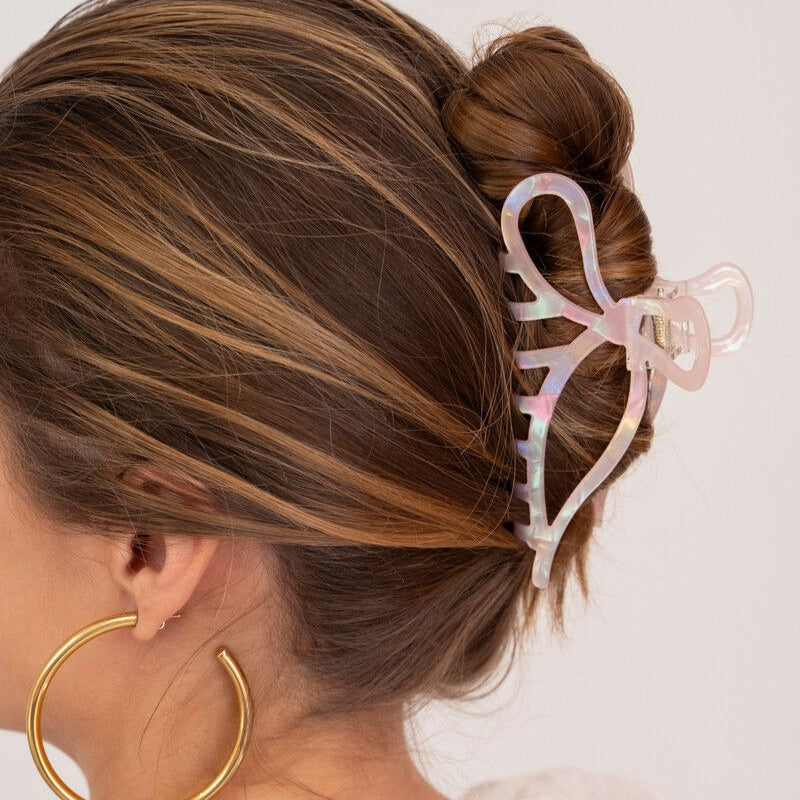 Pince à cheveux rose pâle avec noeud
