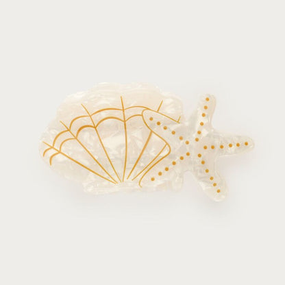 Pince à cheveux blanche avec étoile de mer et coquillage